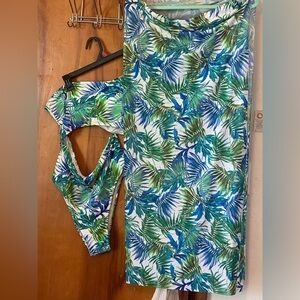 One piece bathing suit with skirt cover never worn.